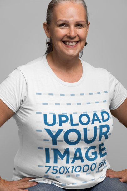 Mockup of a Senior Woman Wearing a T-Shirt with her Hands on her Hips