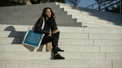 Tote Bag Video of a Woman Sitting on Concrete Stairs 