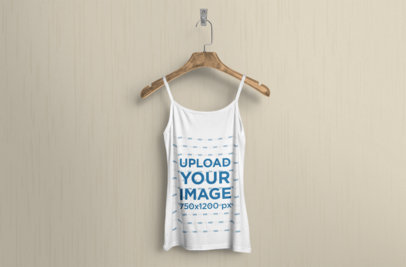 Mockup of a Tank Top Mockup Hanging Against a Solid Color Wall