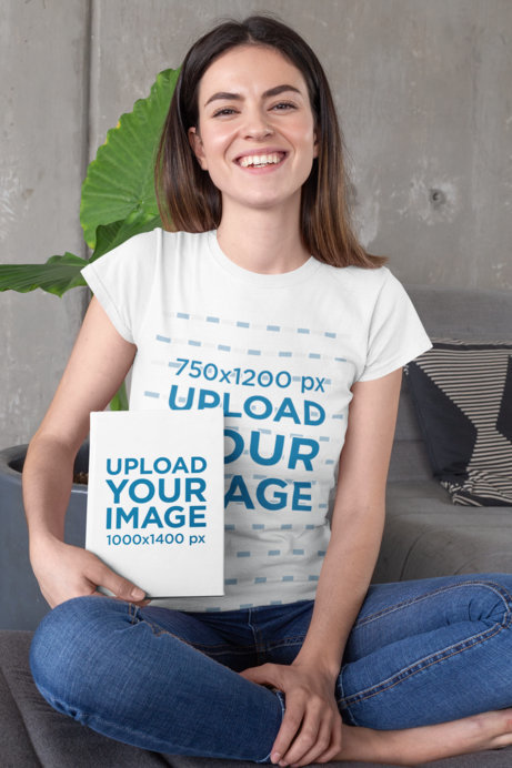 T-Shirt Mockup of a Long-Haired Woman Holding a Book While Sitting on a Couch 