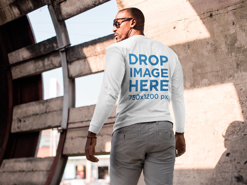 Back of a T-Shirt Mockup of a Man at a Construction Site on a Sunny Day