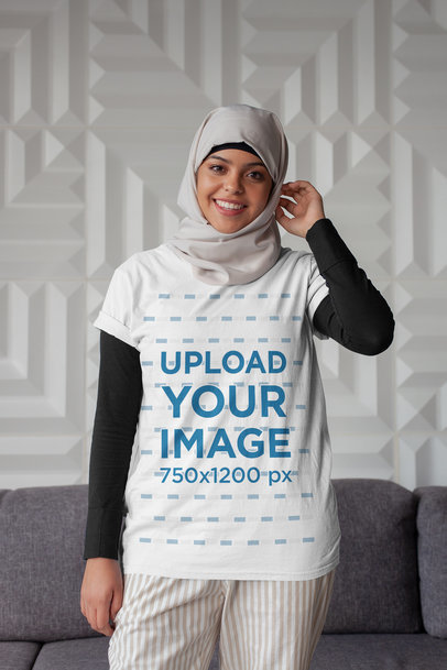 T-Shirt Mockup of a Woman with a Hijab Touching her Head