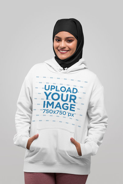 Hoodie Mockup of a Woman with a Hijab with her Hands in Her Pocket