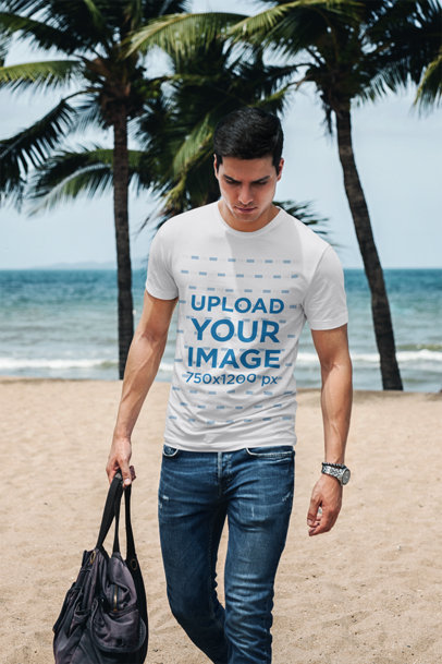 T-Shirt Mockup of a Man Carrying a Bag by the Beach