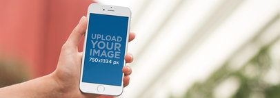 iPhone Mockup Being Used in a Backyard