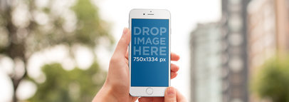 iPhone Mockup Being Used in an Urban Environment