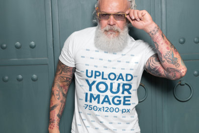 T-Shirt Mockup of a Fashionable Senior Man with Tattooed Arms 28426