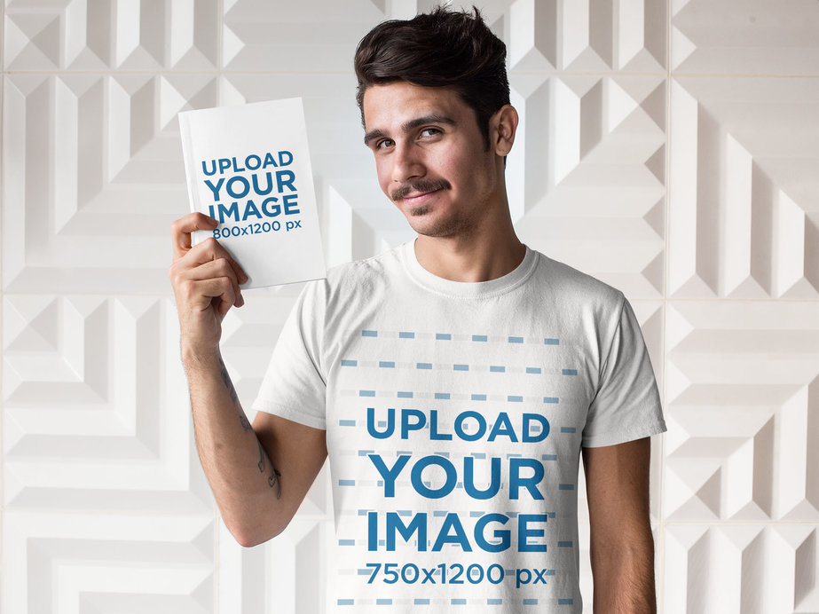 Tee Mockup of a Man Holding a Book Against a White Background 