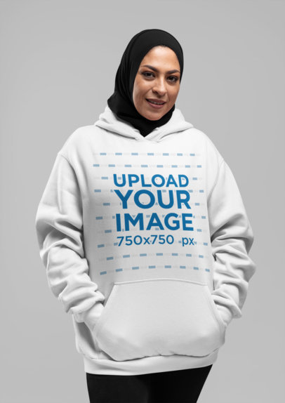 Mockup of a Woman with a Hijab Wearing a Hoodie at a Studio