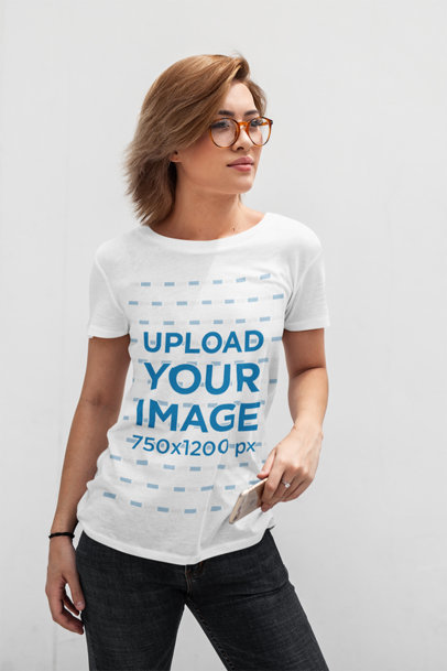 T-Shirt Mockup Featuring a Short-Haired Woman Posing in Front of a White Wall