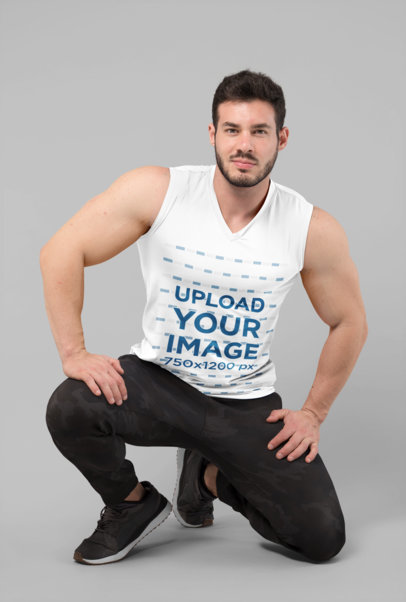 Sleeveless Shirt Mockup of a Man Posing Proudly at a Studio