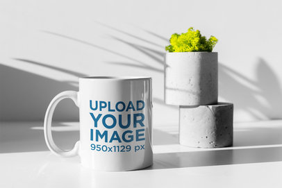 Mockup of an 11 oz Mug with a Plant Pot Under Lights and Shadows