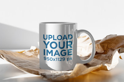 Mockup of an 11 oz Mug Standing on Unfolded Wrapping Paper 401-el