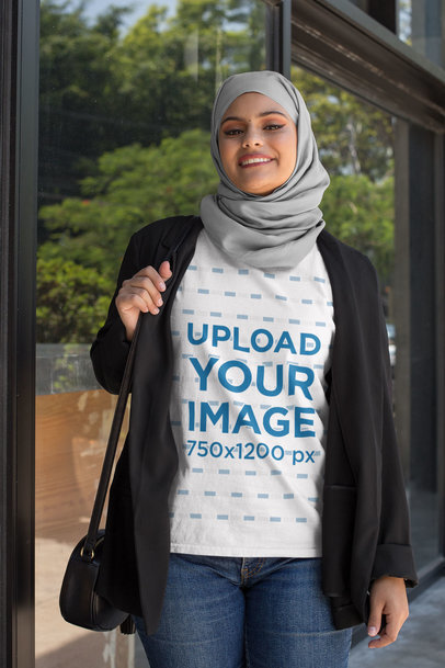T-Shirt Mockup of an Elegant Woman Wearing a Hijab and Carrying a Purse