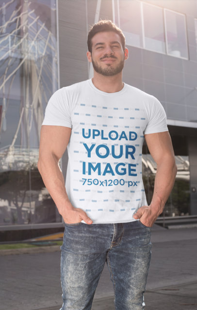 T-Shirt Mockup Featuring a Muscular Man with His Hands in His Pockets