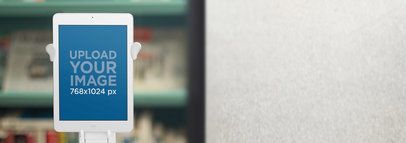 Tablet Mockup of a White iPad at a Bookstore