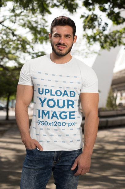 T-Shirt Mockup of a Fitness Man Posing in the Street on a Sunny Day 