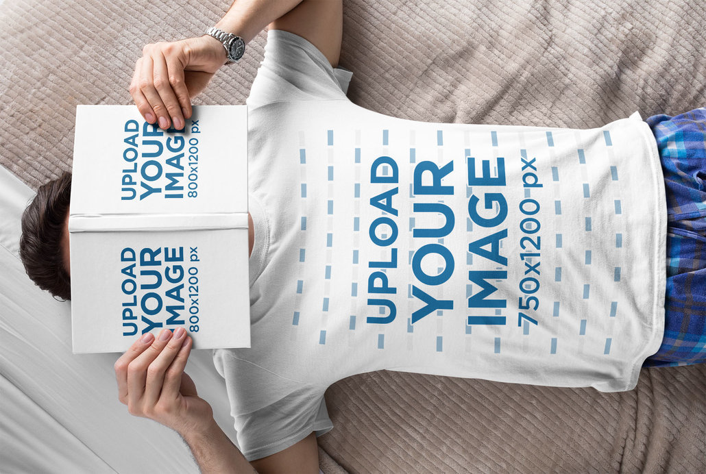T-Shirt Mockup of a Man Lying on a Bed with an Open Book on His Face