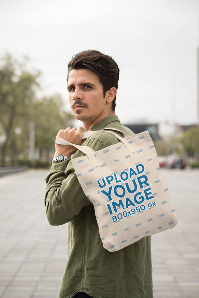 Mockup of a Man with a Mustache Carrying a Tote Bag over His Shoulder