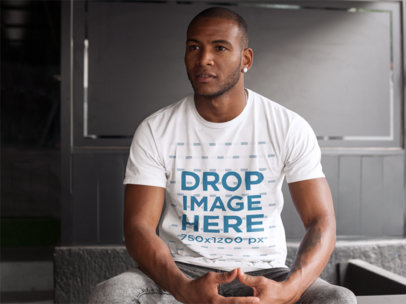 T-Shirt Mockup of a Man at a Bar Waiting for a Friend 9369f