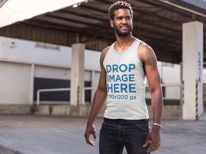 Heathered Tank Top Mockup of a Man Standing Outside a Warehouse