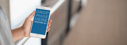 Mockup Template of a Doctor Using an iPhone in a Hospital