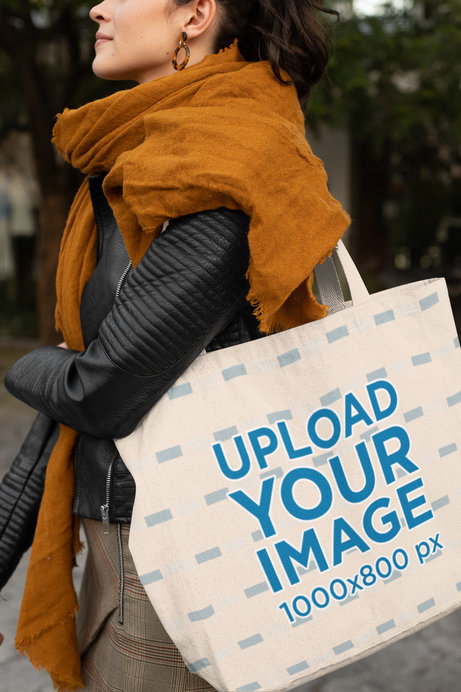Mockup of a Woman Carrying a Tote Bag and Walking on the Street