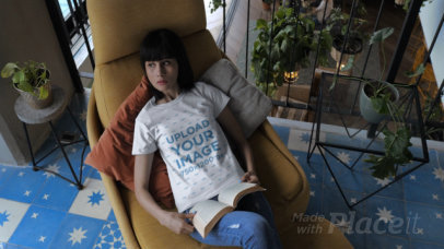 T-Shirt Video of a Woman Reading on a Yellow Couch 