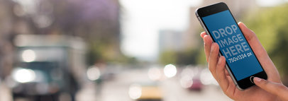 iPhone Mockup of a Man in an Urban Environment