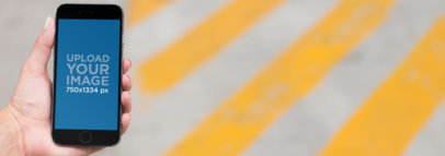 iPhone Mockup of a Woman Crossing the Street