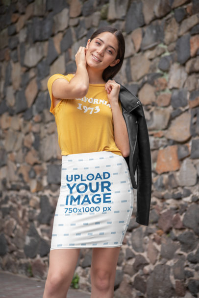 Pencil Skirt Mockup of a Woman Posing Against a Stone Wall