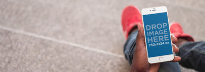 iPhone Mockup of a Guy Sitting on a Stone Staircase 
