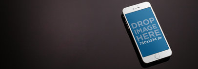 Mockup Template of an iPhone Lying on a Marble Table 9802