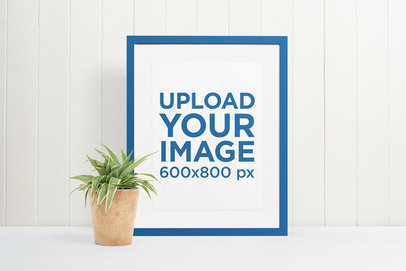 Minimal Mockup of a Picture Frame Next to a Plant Pot 
