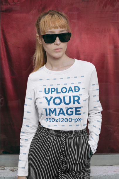 Long Sleeve T-Shirt Mockup Featuring a Woman with Sunglasses Against a Red Background 