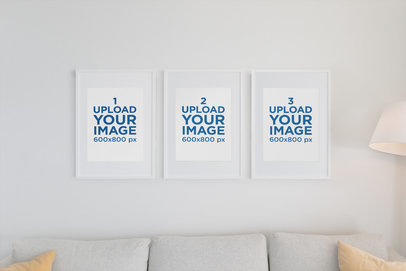 Mockup of Three Poster Frames on a Living Room Wall