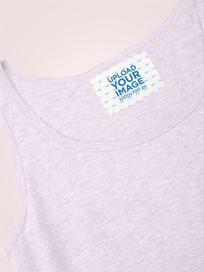 Clothing Label Mockup of a Tank Top Against a Plain Backdrop