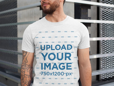 Heathered T-Shirt Mockup Featuring a Man with Tattoos on One Arm 