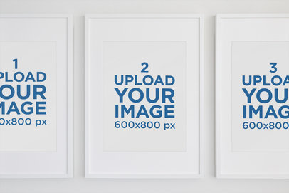 Minimal Mockup Featuring Three Art Prints Hanging on a White Wall 