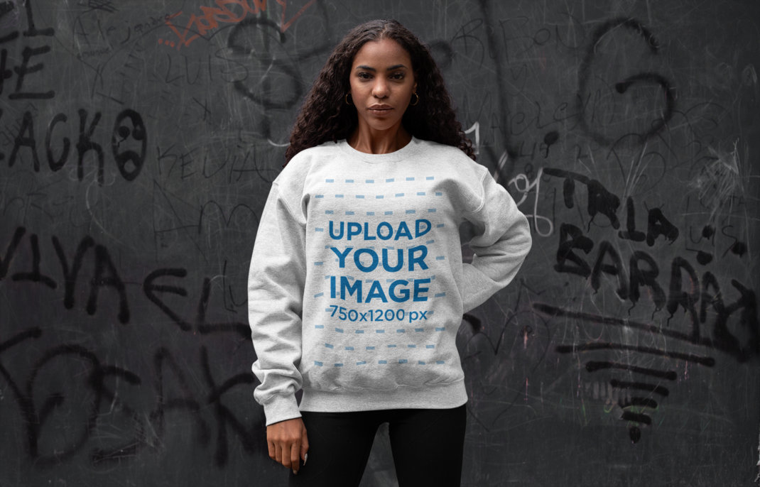 Crewneck Sweatshirt Mockup of a Woman Posing Against a Graffiti Wall 