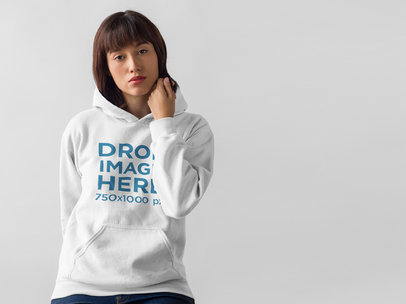 Hoodie Mockup of a Beautiful Woman in a Photo Studio 