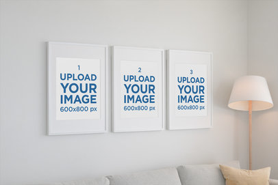 Mockup of Three Poster Frames Hanging on a Living Room Wall