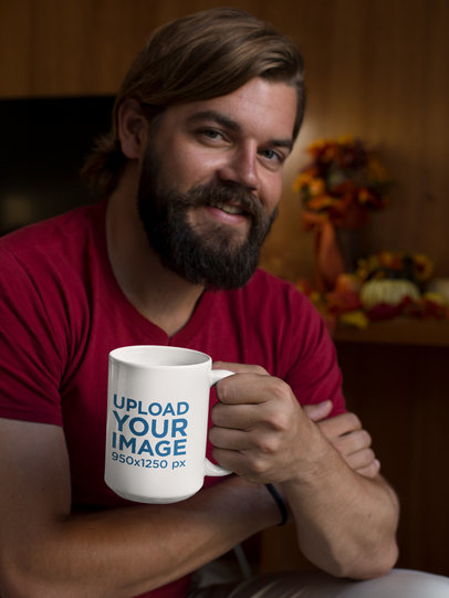 15 oz Mug Mockup Featuring a Bearded Man in a Cozy Room With Fall Decorations
