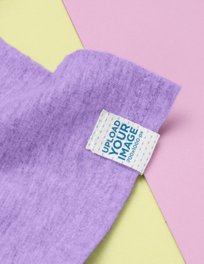 Clothing Label Mockup on a Sleeve Featuring a Bicolored Surface