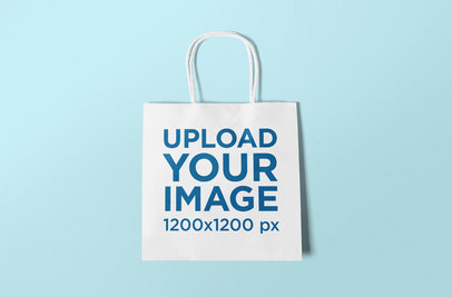 Mockup of a Squared Gift Bag Lying Flat on a Colored Background 650-el
