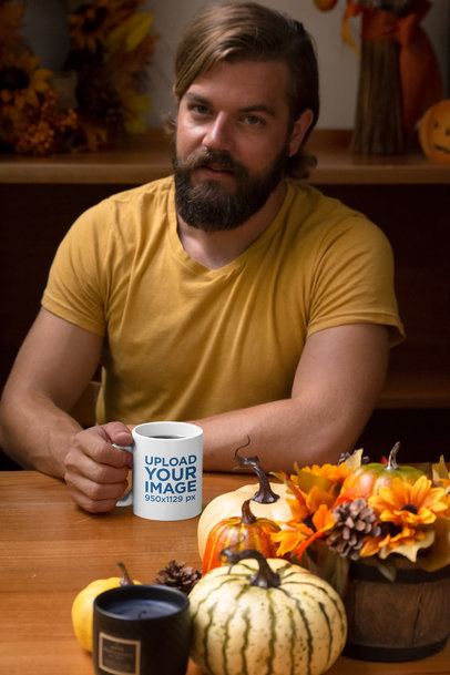 Mockup of a Man Drinking from an 11 oz at the Table