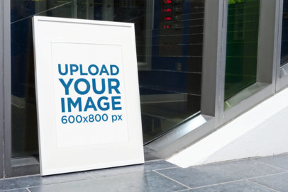 Mockup of a Poster Frame Leaning on a Window 