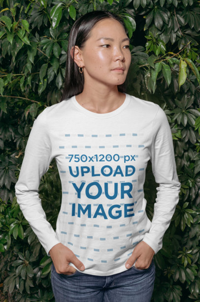 Long Sleeve Tee Mockup Featuring a Serious-Looking Woman by a Wall Covered in Lush 29071