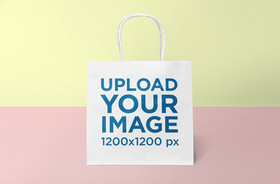 Gift Bag Mockup Featuring a Minimal Colored Background 