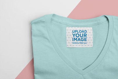 Mockup of an Inside Clothing Label on a Folded V-Neck Tee 